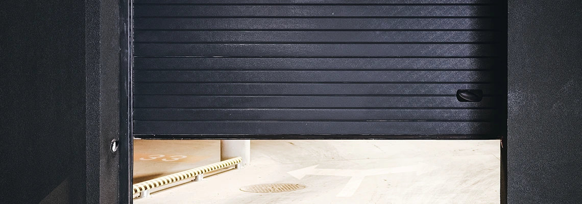 Residential Black Garage Door Installation in Calvin Park, ON